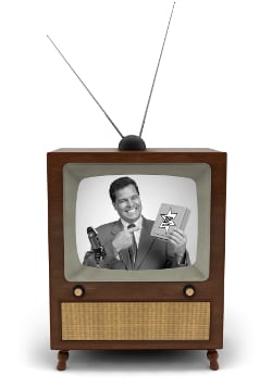 1950s television with a newscaster reading a news bulletin