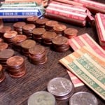 Pennies, quarters, dimes, and nickels in rolls