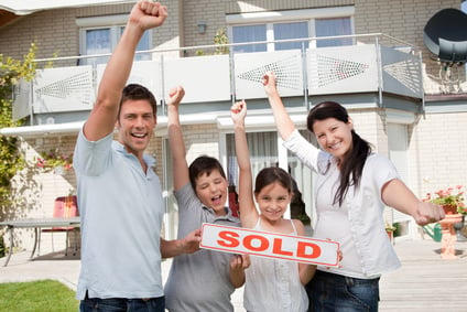 Happy family celebrating buying their new house