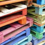Piles of colorful wooden pallets