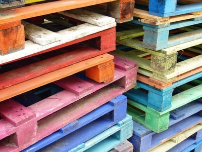 Piles of colorful wooden pallets