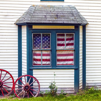 Old House With American Flag in Window