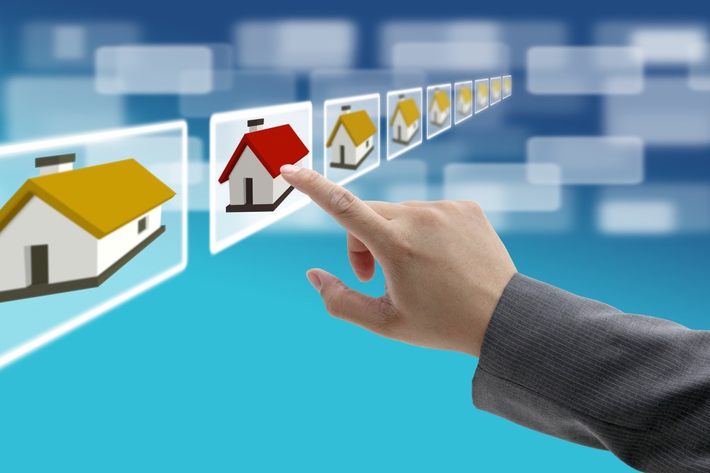 man hand Finding new property in real estate market with electro