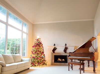 Living room decorated with Christmas tree and hanging stockings