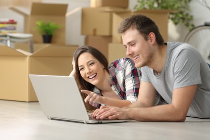 Couple moving house searching on line