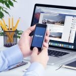 Facebook app on the Apple iPhone display and desktop version of