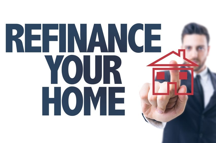 Business man pointing the text Refinance Your Home