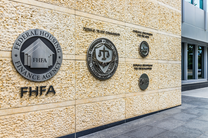 Federal Trade Commission and Housing Finance Agency seals in downtown with closeup of sign and logo