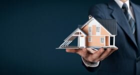 real estate agent offers a house