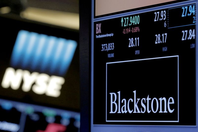 FILE PHOTO The ticker and trading information for Blackstone Group is displayed at the post where it is traded on the floor of the New York Stock Exchange