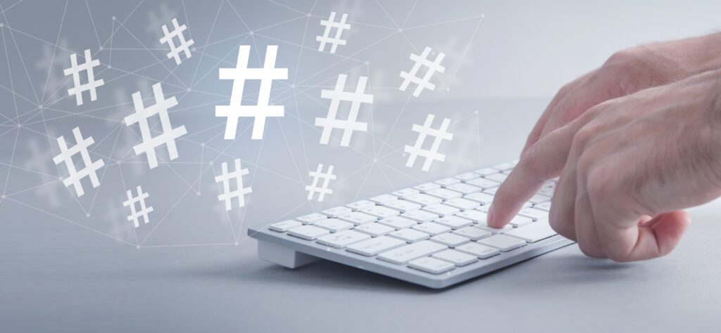 MaleHandsTypingInComputerKeyboardHashtagSocialMedia