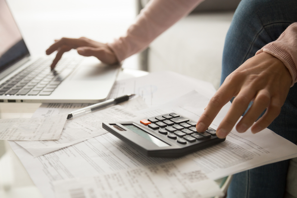 woman calculating to becoming a budgeting pro