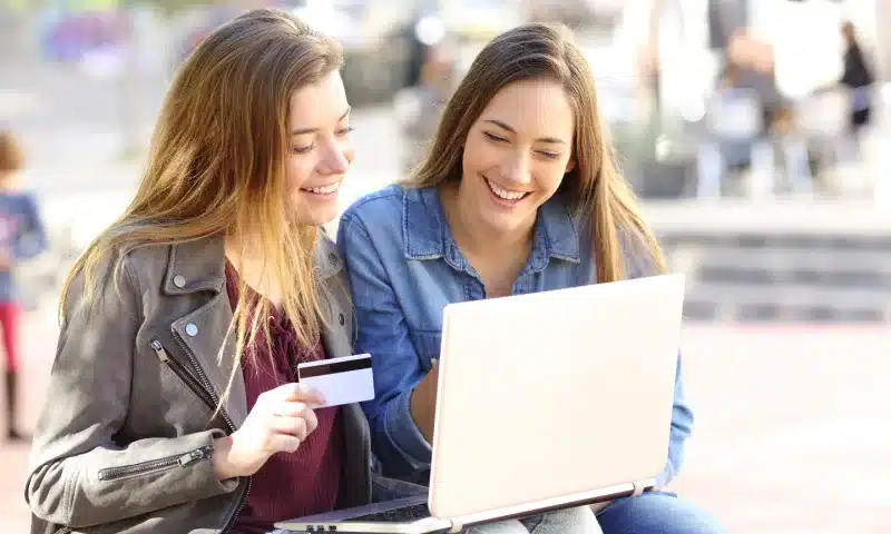 two friends buying with online credit